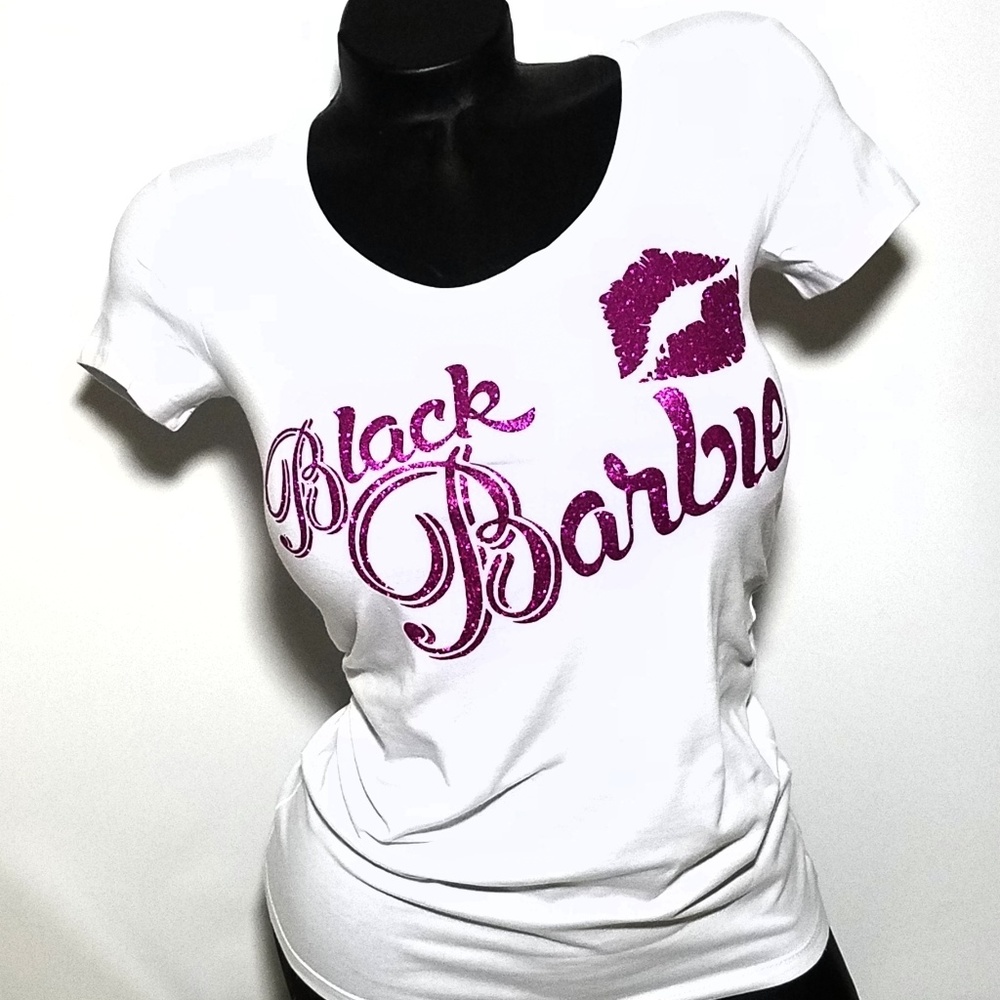 Black Barbie on a white fitted spandex tee.